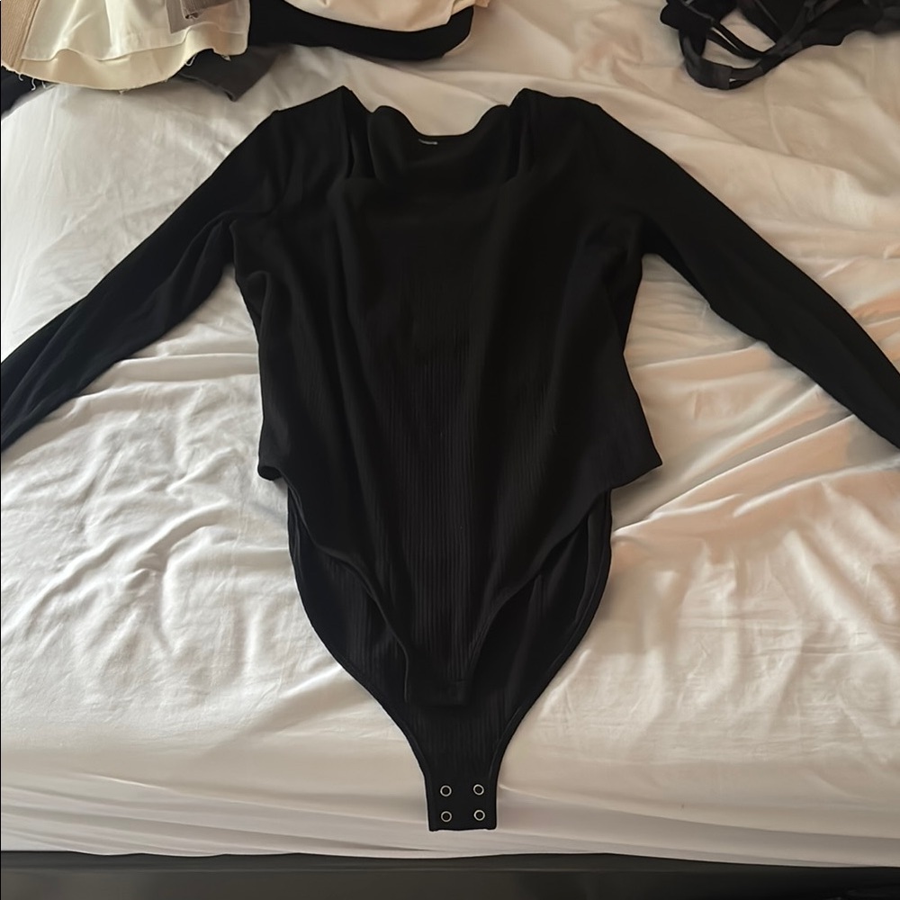 Women’s black body suit